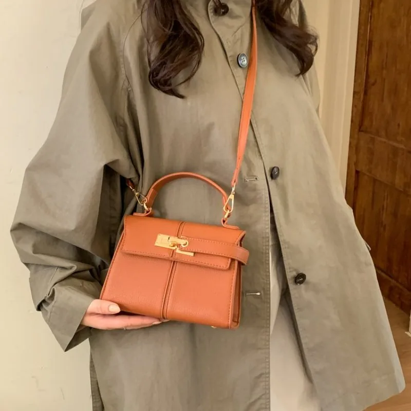 エレガントなミニマリストおむつバッグハンドバッグバックパック - Leatherwork Essentials のレビューと価格