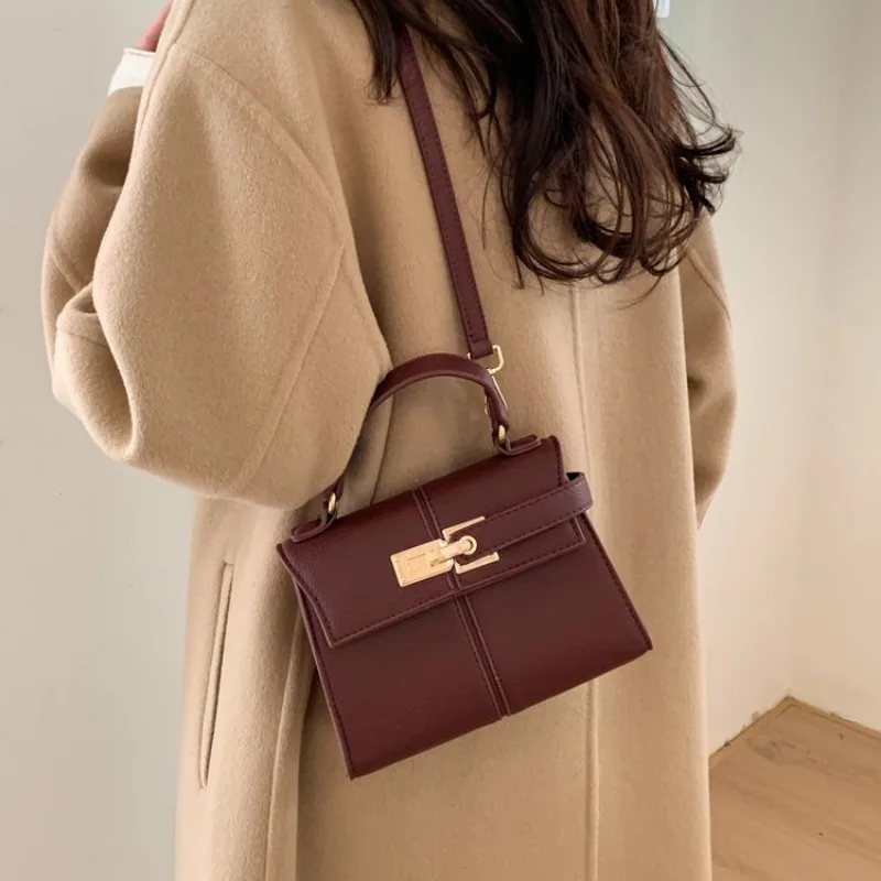 エレガントなミニマリストおむつバッグハンドバッグバックパック - Leatherwork Essentials のレビューと価格